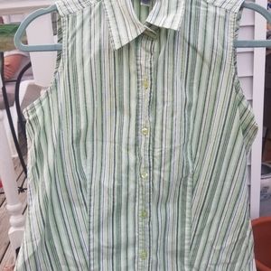 Ladies sleeveless button up collared blouse.